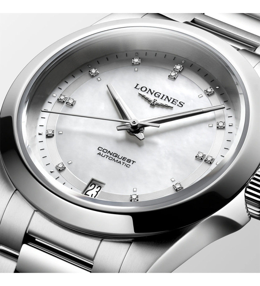 Montre Longines Conquest automatique cadran nacre blanche index diamants bracelet acier 34 mm