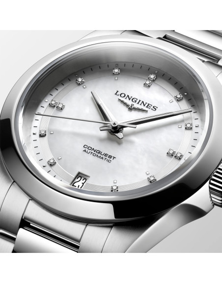 Montre Longines Conquest automatique cadran nacre blanche index diamants bracelet acier 34 mm